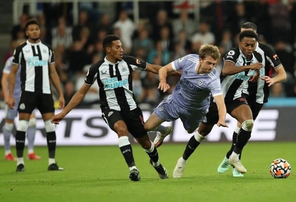 Isaac Hayden of Newcastle United and Patrick Bamford of Leeds United battle for the ball during the Premier League match between Newcastle United and...