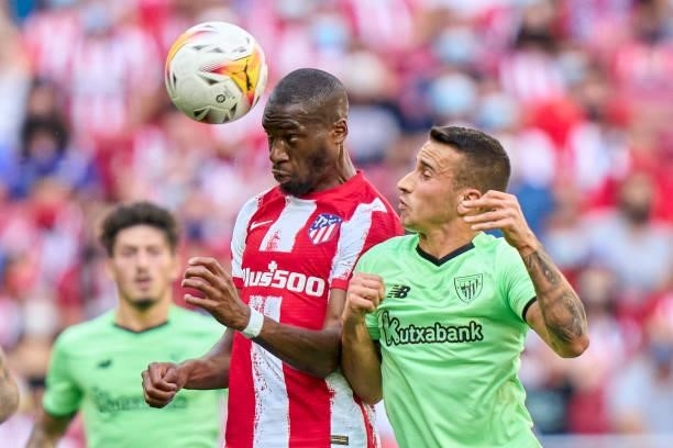 Geoffrey Kondogbia of Atletico de Madrid battle for the ball with Alex Berenguer of Athletic Club during the La Liga Santander match between Club...