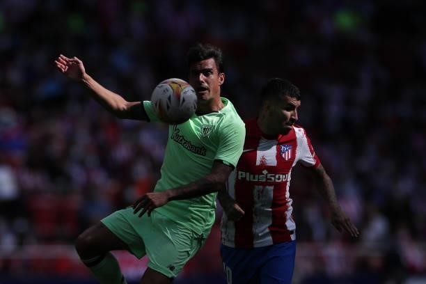 Dani García of Athletic Club competes for the ball with Angel Correa of Atletico de Madrid during the La Liga Santander match between Club Atletico...