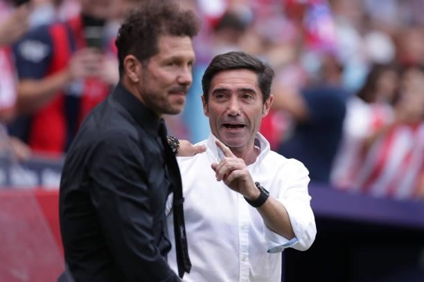 Manager Marcelino Garcia of Athletic Club waves manager Diego Simeone of Atletico de Madrid prior to start the La Liga Santander match between Club...