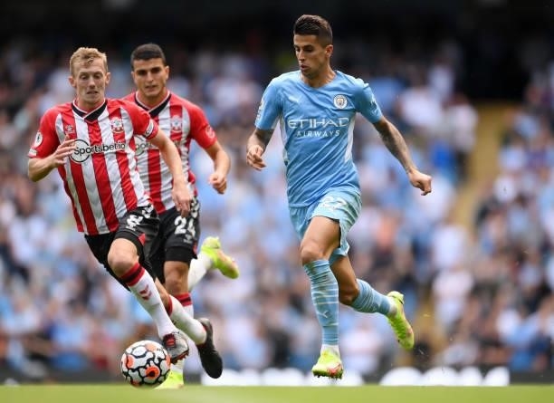 Joao Cancelo of Manchester City runs with the ball during the Premier League match between Manchester City and Southampton at Etihad Stadium on...
