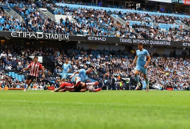 Adam Armstrong of Southampton is brought down by Kyle Walker of Manchester City but VAR rules no penalty during the Premier League match between...