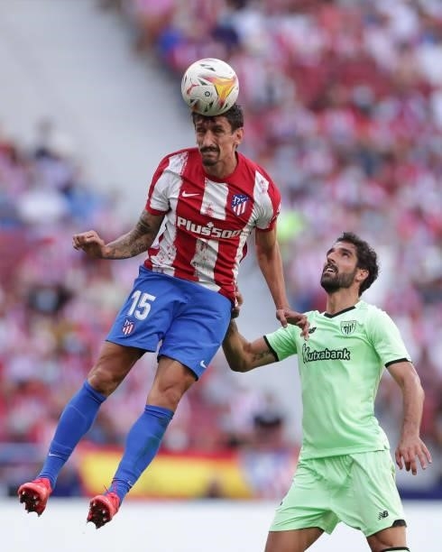 Raul Garcia of Athletic Club competes for the ball with Stefan Savic of Atletico de Madrid during the La Liga Santander match between Club Atletico...