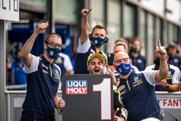 Moto3 rider Romano Fenati of Italy and Sterilgarda Max Racing Team celebrates with his team the pole position during the qualifying session of the...