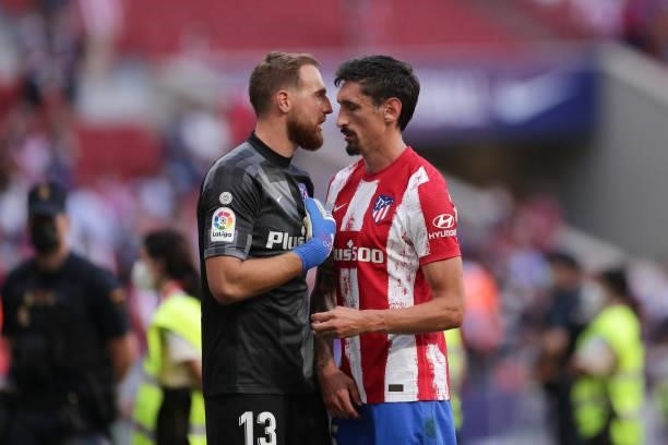 Goalkeeper Jan Oblak of Atletico de Madrid speaks with his teammate Stefan Savic after the La Liga Santander match between Club Atletico de Madrid...