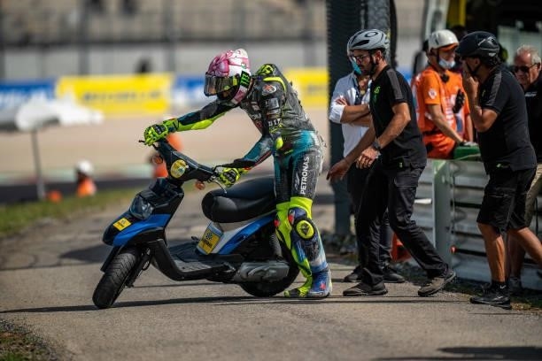 Valentino Rossi of Italy and Petronas Yamaha SRT is using a scooter to get back in the garage, after his crash during the qualifying session of the...