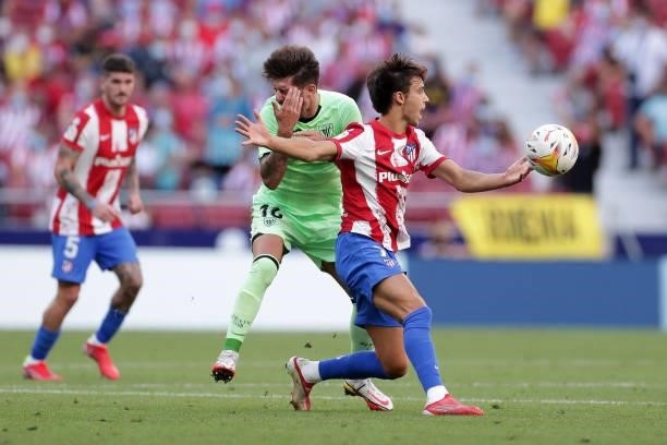 Joao Felix of Atletico de Madrid protests as he clashes with Unai Vencedor of Athletic Club during the La Liga Santander match between Club Atletico...