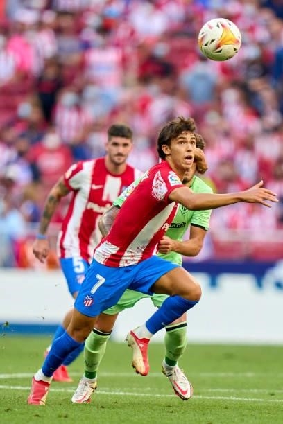 Joao Felix of Atletico de Madrid battles for the ball with Unai Vencedor of Athletic Club during the La Liga Santander match between Club Atletico de...