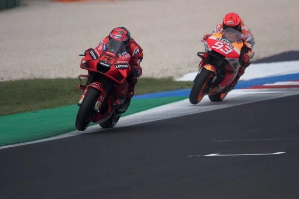 Francesco Bagnaia of Italy and Ducati Lenovo Team leads Marc Marquez of Spain and Repsol Honda Team during the qualifying practice during the MotoGP...