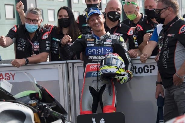 Dominique Aegerter of Germany and Dynavolt Intact GP celebrates with team under the podium during the MotoE race 1 during the MotoGP Of San Marino -...