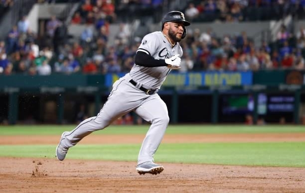 Yoan Moncada of the Chicago White Sox rounds third base on his way to scoring a run against the Texas Rangers during the second inning at Globe Life...