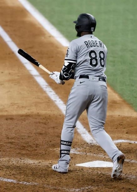 Luis Robert of the Chicago White Sox hits a three run double against the Texas Rangers during the fourth inning at Globe Life Field on September 17,...