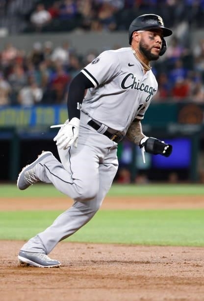 Yoan Moncada of the Chicago White Sox rounds third base on his way to scoring a run against the Texas Rangers during the second inning at Globe Life...