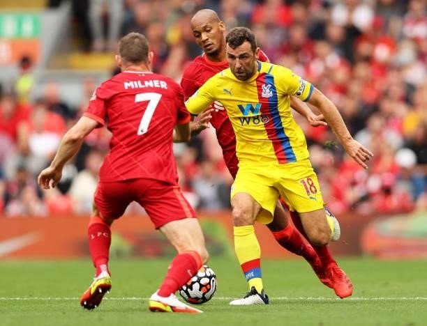 James McArthur of Crystal Palace and James Milner of Liverpool clash during the Premier League match between Liverpool and Crystal Palace at Anfield...