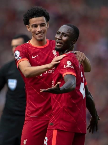 Naby Keïta of Liverpool is congratulated by team mate Curtis Jones during the Premier League match between Liverpool and Crystal Palace at Anfield on...