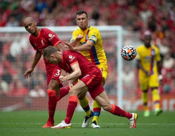 James McArthur of Crystal Palace in action with James Milner and Fabinho of Liverpool during the Premier League match between Liverpool and Crystal...