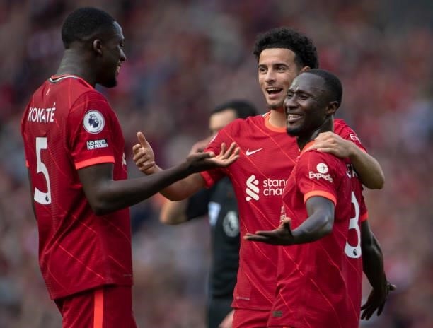 Naby Keïta of Liverpool is congratulated by team mates Curtis Jones and Ibrahima Konaté after scoring the third goal during the Premier League match...