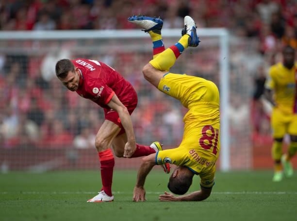 James McArthur of Crystal Palace in action with James Milner of Liverpool during the Premier League match between Liverpool and Crystal Palace at...