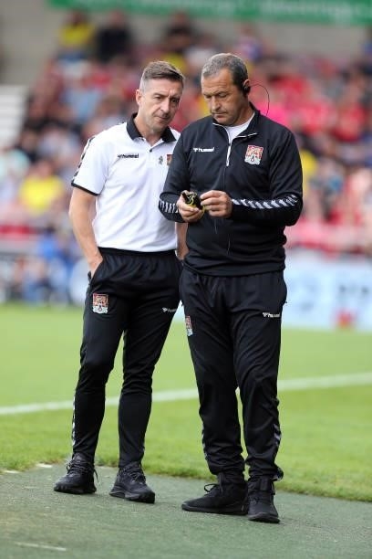 Northampton Town manager Jon Brady with assistant manager Colin Calderwood during the Sky Bet League Two match between Northampton Town and Swindon...