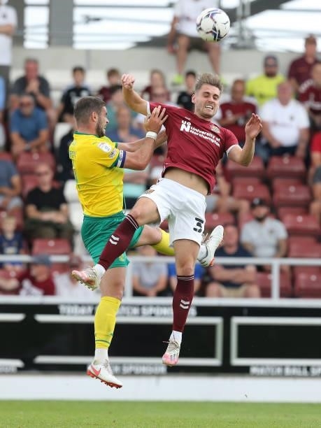 Dion Conroy of Swindon Town contests the ball with Danny Rose of Northampton Town during the Sky Bet League Two match between Northampton Town and...