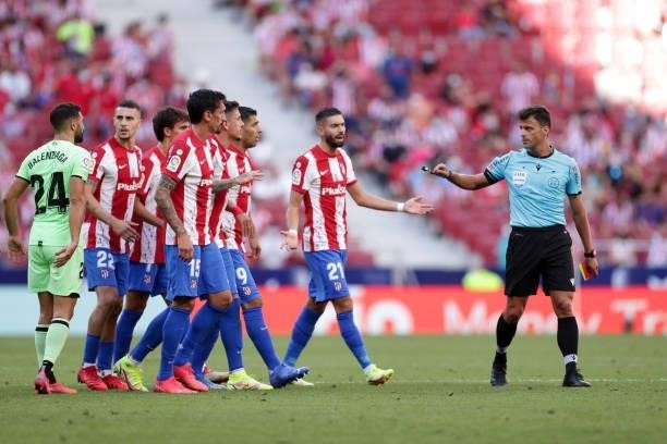 Atletcio de Madrid players protest to referee Gil Manzano during the La Liga Santander match between Club Atletico de Madrid and Athletic Club at...