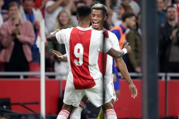 Danilo Pereira da Silva of Ajax celebrates his goal with David Neres during the Dutch Eredivisie match between Ajax and SC Cambuur at Johan Cruijff...