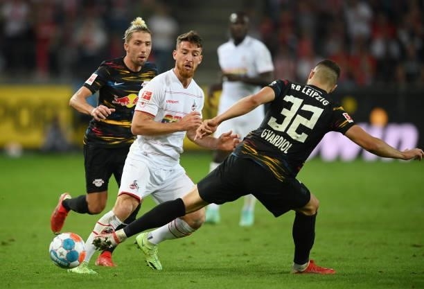 Salih Oezcan of 1. FC Koeln is challenged by Kevin Kampl of Leipzig during the Bundesliga match between 1. FC Köln and RB Leipzig at...