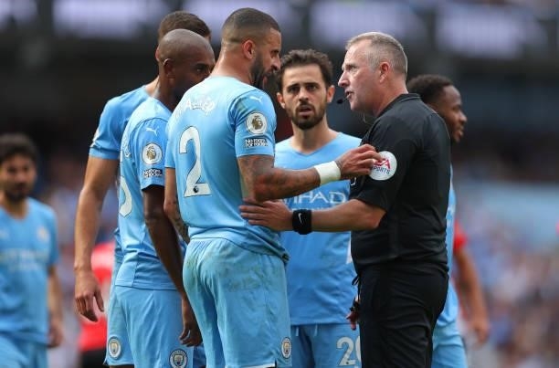 Kyle Walker of Manchester City protests to Referee Jonathan Moss after being shown a red card which is later overturned following a VAR review during...