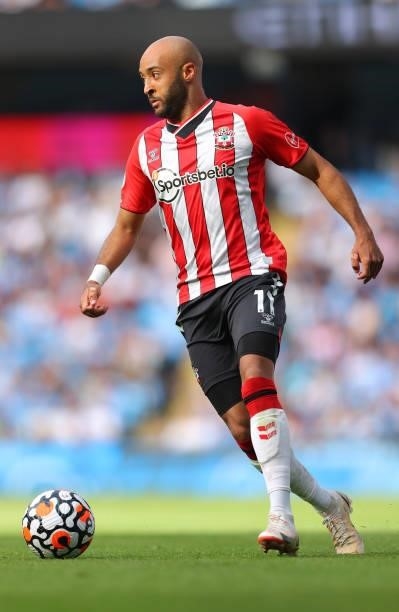 Nathan Redmond of Southampton runs with the ball during the Premier League match between Manchester City and Southampton at Etihad Stadium on...