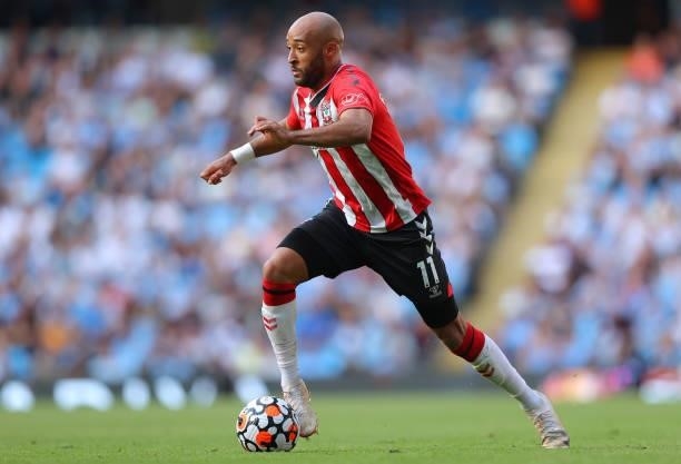 Nathan Redmond of Southampton runs with the ball during the Premier League match between Manchester City and Southampton at Etihad Stadium on...