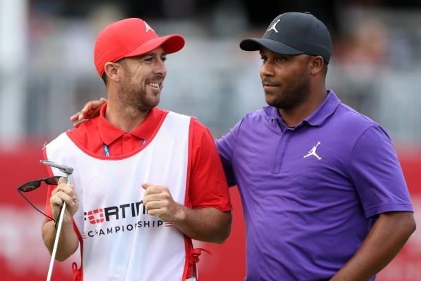 Harold Varner III walks with his caddie on the 18th hole during round three of the Fortinet Championship at Silverado Resort and Spa on September 18,...