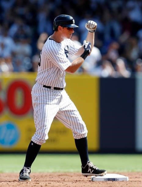 LeMahieu of the New York Yankees reacts at second base after his double during the first inning against the Cleveland Indians at Yankee Stadium on...