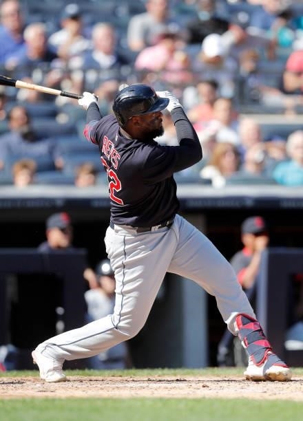 Franmil Reyes of the Cleveland Indians follows through on a fifth inning RBI double against the New York Yankees at Yankee Stadium on September 18,...