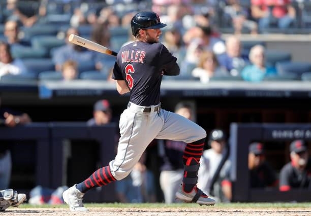 Owen Miller of the Cleveland Indians follows through on a fifth inning RBI base hit against the New York Yankees at Yankee Stadium on September 18,...