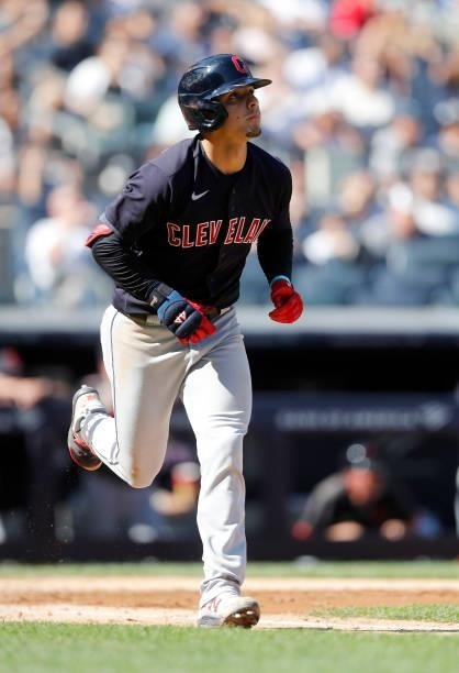 Andres Gimenez of the Cleveland Indians watches the flight of his fifth inning three run home run against the New York Yankees at Yankee Stadium on...