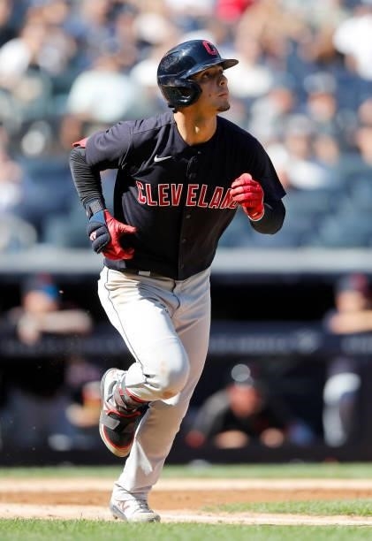Andres Gimenez of the Cleveland Indians watches the flight of his fifth inning three run home run against the New York Yankees at Yankee Stadium on...