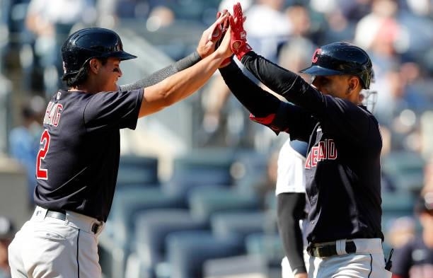 Andres Gimenez of the Cleveland Indians celebrates his fifth inning three run home run against the New York Yankees with teammate Yu Chang at Yankee...