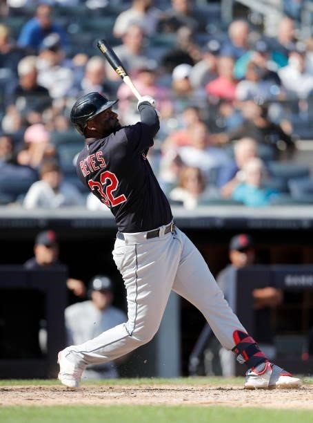 Franmil Reyes of the Cleveland Indians follows through on his sixth inning two run home run against the New York Yankees at Yankee Stadium on...