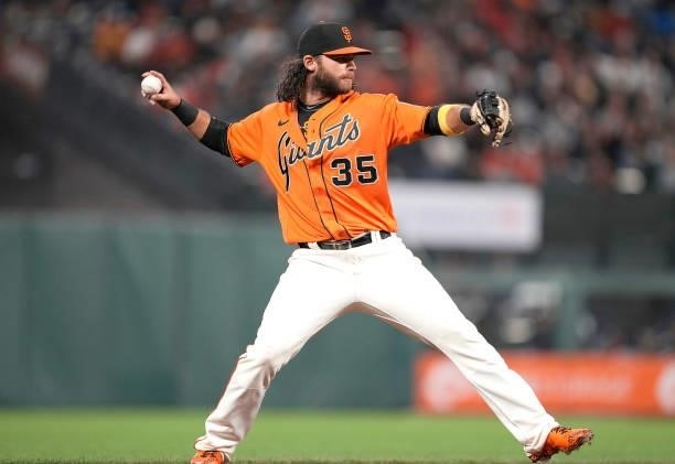 Brandon Crawford of the San Francisco Giants looks throw to first base to throw out Dansby Swanson of the Atlanta Braves in the top of the second...