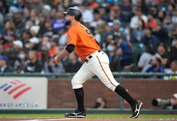 Brandon Belt of the San Francisco Giants hits a two-run home run against the Atlanta Braves in the bottom of the first inning at Oracle Park on...