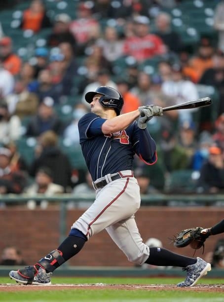 Adam Duvall of the Atlanta Braves hits a two-run RBI double against the San Francisco Giants in the top of the first inning at Oracle Park on...