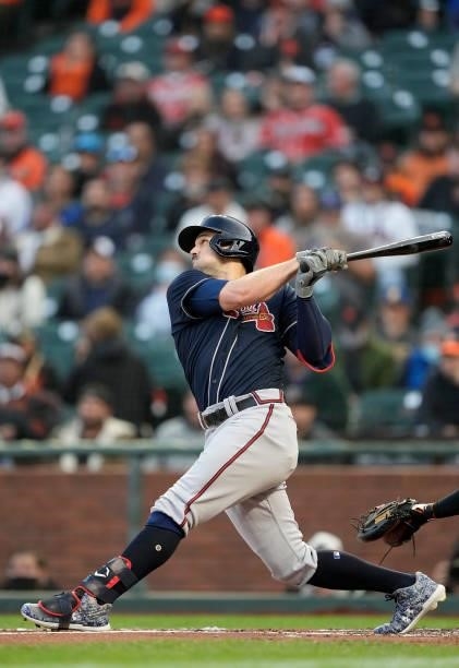 Adam Duvall of the Atlanta Braves hits a two-run RBI double against the San Francisco Giants in the top of the first inning at Oracle Park on...