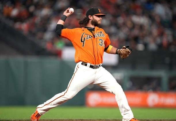 Brandon Crawford of the San Francisco Giants looks throw to first base to throw out Dansby Swanson of the Atlanta Braves in the top of the second...