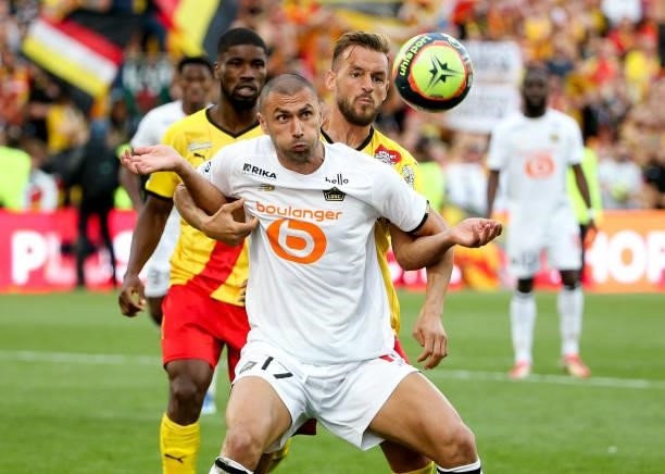 Burak Yilmaz of Lille, Jonathan Gradit of Lens during the Ligue 1 Uber Eats match between RC Lens and Lille OSC at Stade Bollaert-Delelis on...
