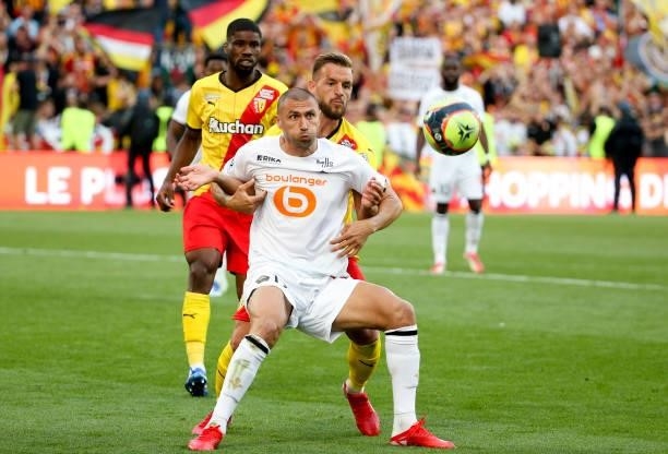 Burak Yilmaz of Lille, Jonathan Gradit of Lens during the Ligue 1 Uber Eats match between RC Lens and Lille OSC at Stade Bollaert-Delelis on...