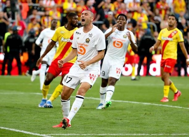 Burak Yilmaz of Lille reacts after missing a goal during the Ligue 1 Uber Eats match between RC Lens and Lille OSC at Stade Bollaert-Delelis on...