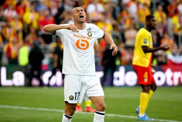 Burak Yilmaz of Lille reacts after missing a goal during the Ligue 1 Uber Eats match between RC Lens and Lille OSC at Stade Bollaert-Delelis on...