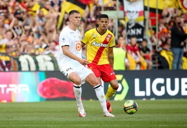 Sven Botman of Lille, Florian Sotoca of Lens during the Ligue 1 Uber Eats match between RC Lens and Lille OSC at Stade Bollaert-Delelis on September...
