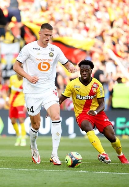 Sven Botman of Lille, Arnaud Kalimuendo of Lens during the Ligue 1 Uber Eats match between RC Lens and Lille OSC at Stade Bollaert-Delelis on...