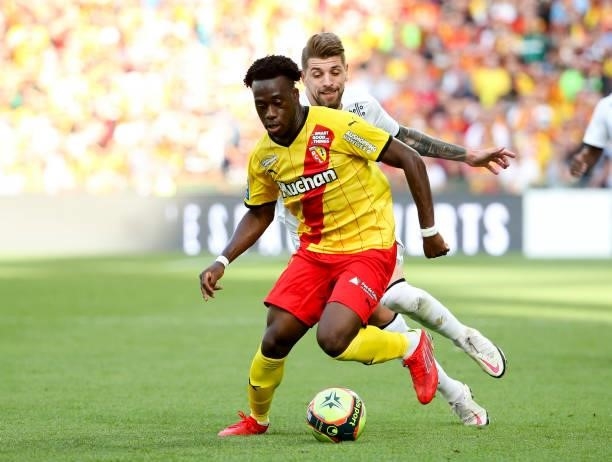 Arnaud Kalimuendo of Lens, Xeka of Lille during the Ligue 1 Uber Eats match between RC Lens and Lille OSC at Stade Bollaert-Delelis on September 18,...